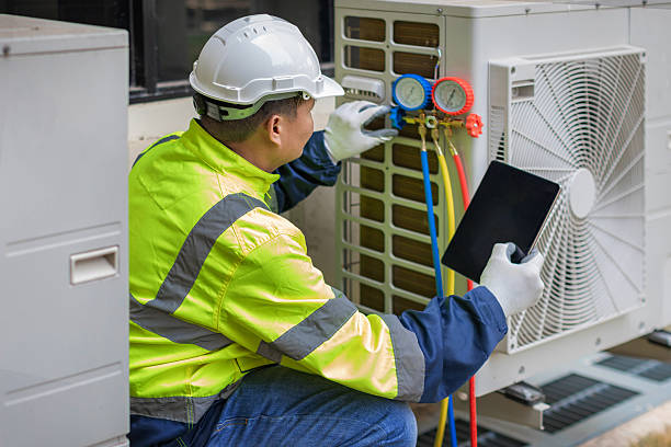 Professional Air Duct Cleaning technician working in East Providence, RI